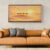 Golden Caravan at Sunset – Dreamy Camel Desert Wall Art Print 04 Panoramic camel desert sunset wall art framed above brown leather sofa in warm neutral interior
