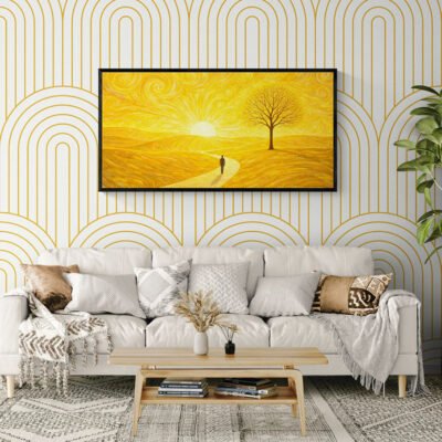 Minimalist yellow sun landscape wall art in black frame above modern white sofa with geometric wallpaper