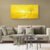 Golden sunset minimalist canvas art displayed above neutral sofa in modern home interior