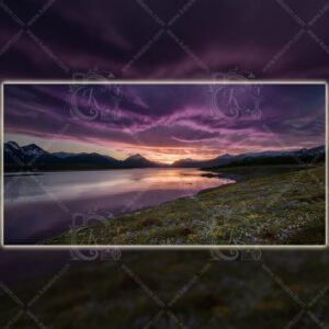 Purple twilight sky over alpine lake with mountain silhouettes and wildflowers