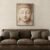 Serene Stone Buddha Wall Art with Gold Urna - Minimal Zen Meditation Artwork 02 Minimal Zen Buddha face wall art displayed above leather sofa in modern living room.