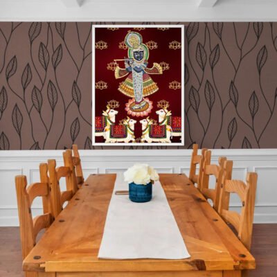 Shreenathji Pichwai wall art displayed above wooden dining table in traditional interior.