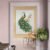 Golden peacock modern wall art in elegant entryway with decorative plants